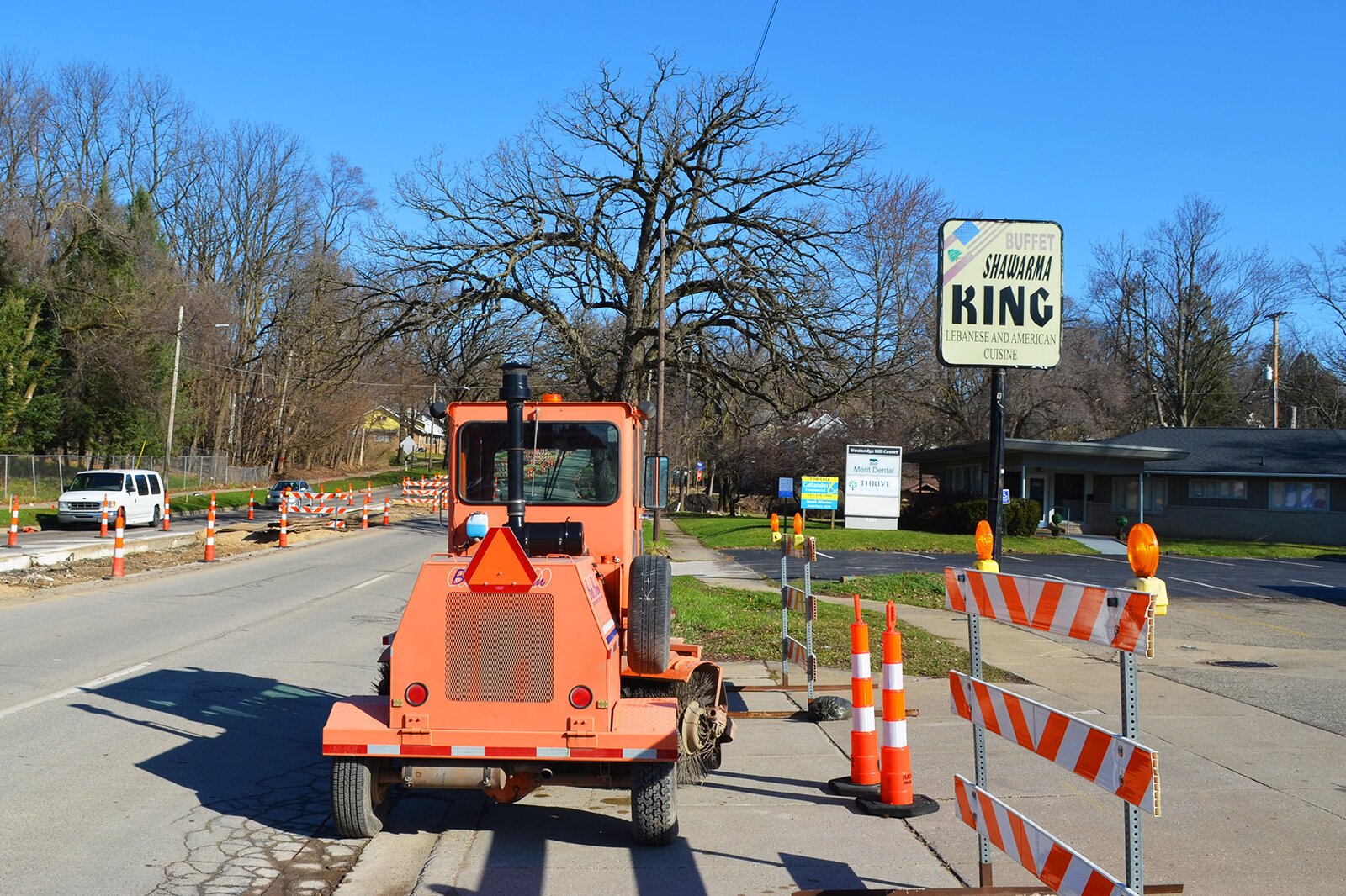 The water main road closure completely blocks the main entrance to both Shawarma King and Thrive Adult Day Center.
