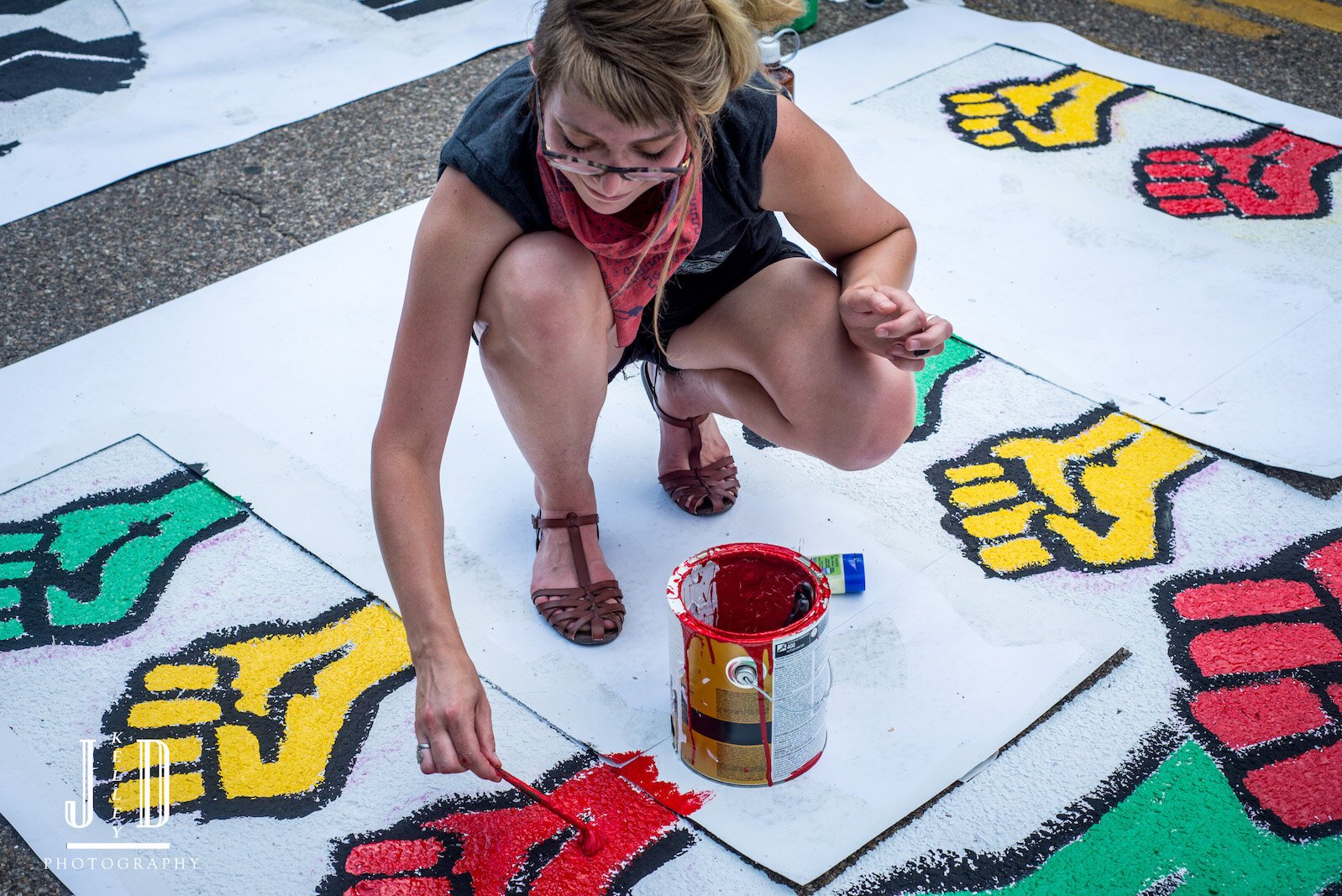 Painting Black Lives Matter mural on Rose Street, between Lovell and South streets on Friday afternoon.