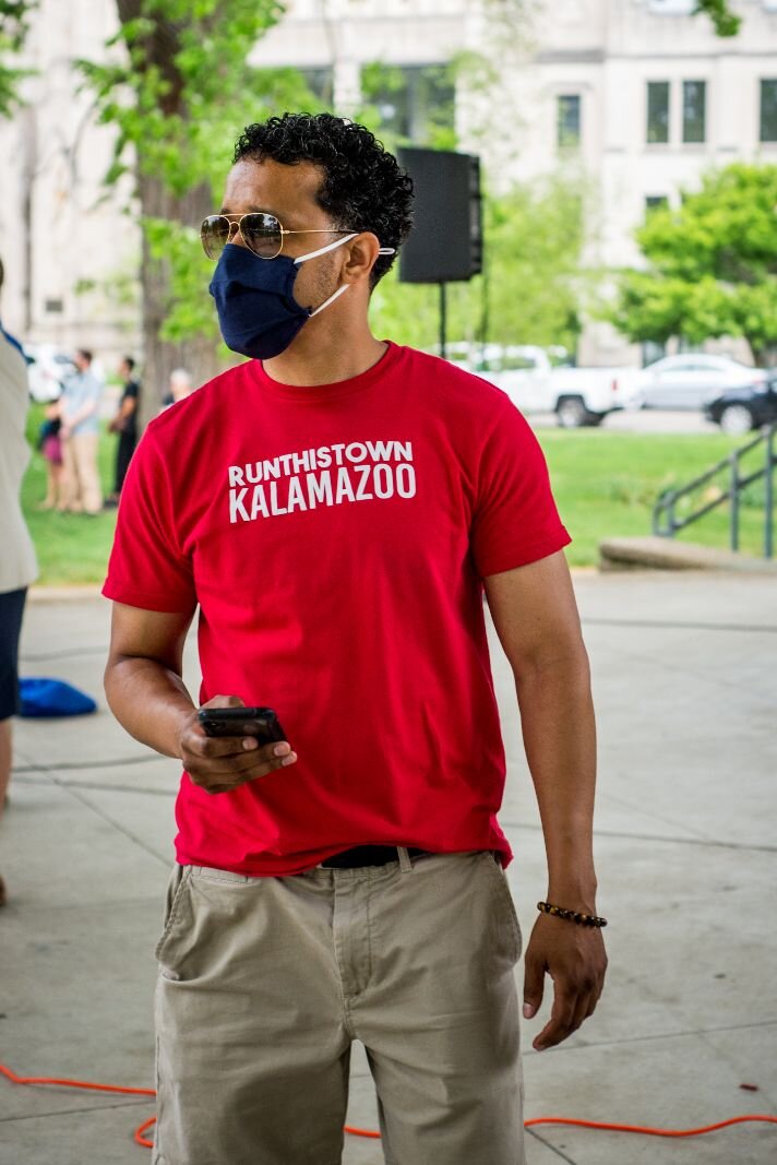 Kalamazoo City Commissioner Eric Cunningham of Run This Town joined the gathering at Bronson Park.