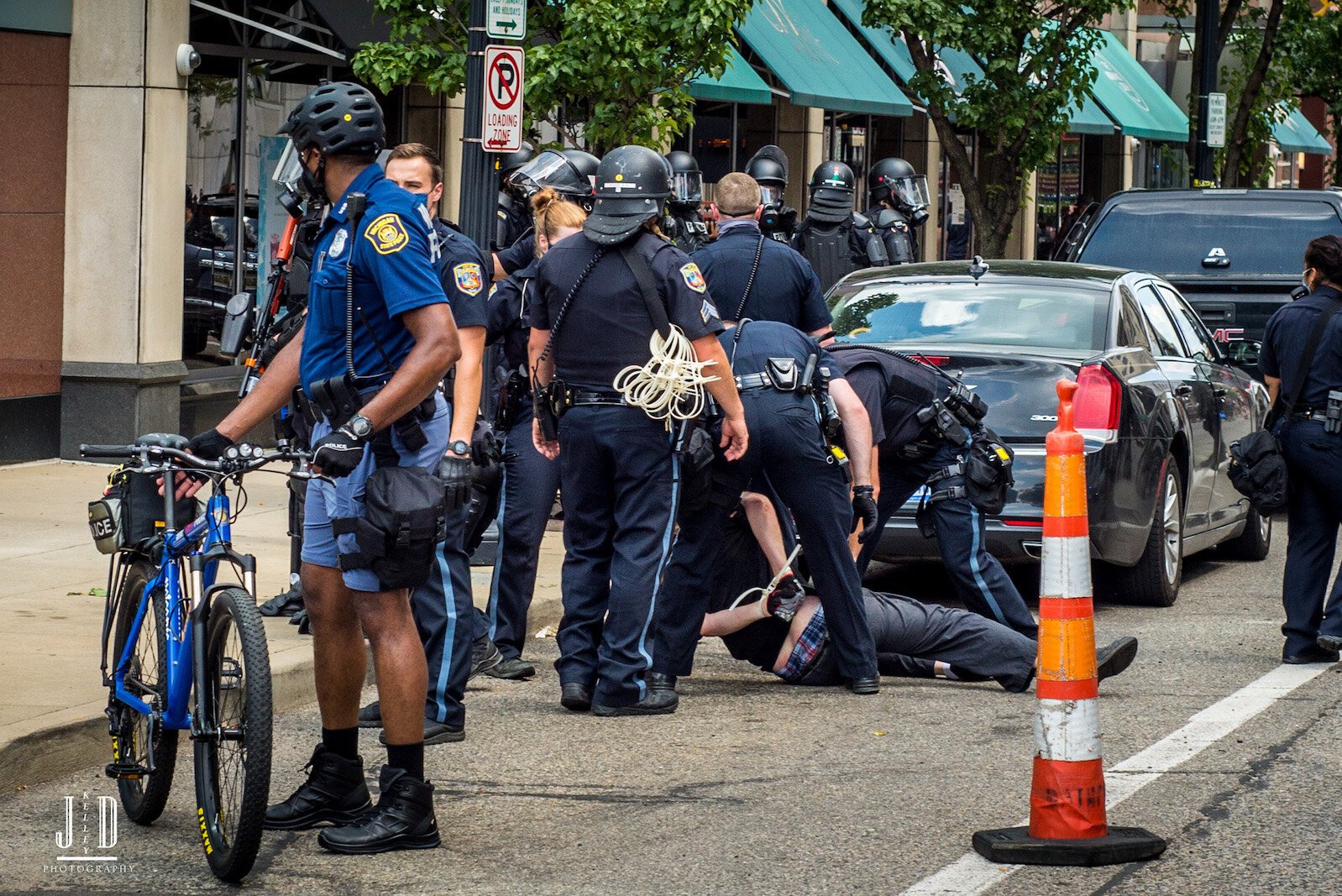 Police make an arrest at the Proud Boys counterprotest.