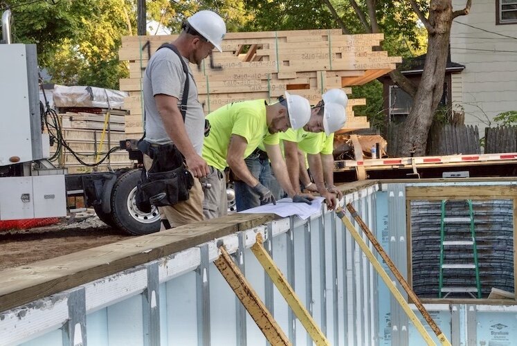 KNHS works with the Home Builders Association of West Michigan to construct new housing in the city’s core neighborhoods. By the end of this year, contractors with the Home Builders will have built 16 homes during the 4-year-old partnership. 