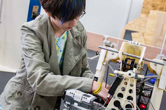 Maddie Dwyer works on her robot