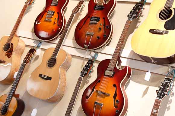 Wall of guitars as you enter the Guitar Shop