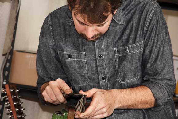 Ry Charters repairs guitar