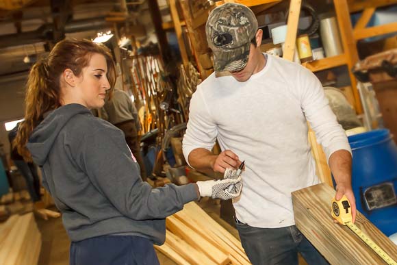 Christina Bartone and Nick Zacker Measure and mark lumber