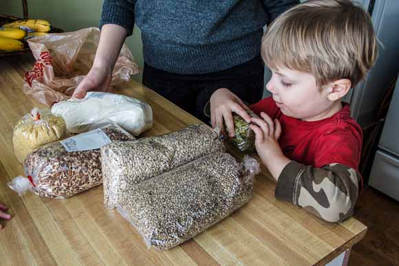 Viggo helps unpack dried beans