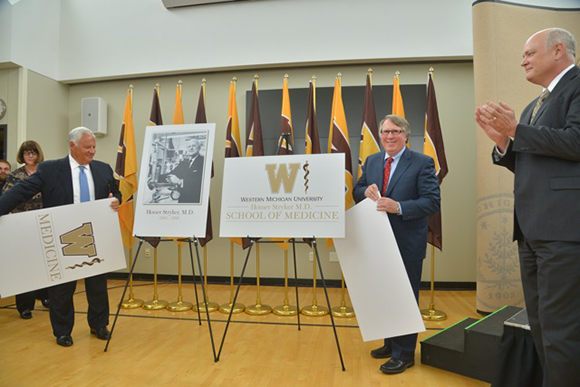 Frank Sardone and Paul Spaude reveal the new name for WMU's med school.