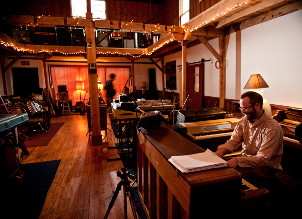 Marq Thompson practices piano at Double Phelix Studio.