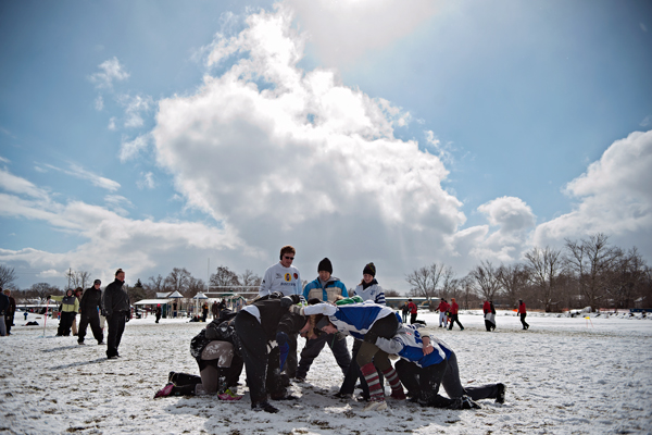Two of the female teams in the Snowball Rugby Tournament scrum during their game. 