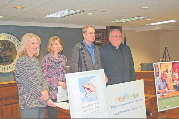 State housing administrators joined Jackson-area local officials and faith leaders during an April 8 press conference at Jackson City Hall to promote the Step Forward Michigan Faith Partnership, which offers free help to prevent foreclosure. Pictured