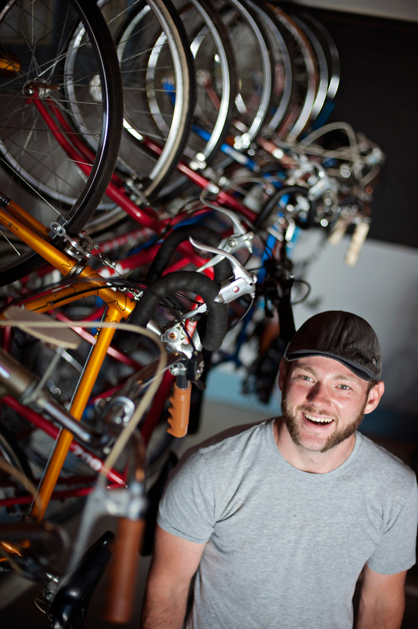 Ryan Barber works outside his Bike Shop off Westnedge Avenue. 