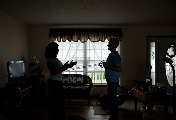 Elisa Dely, left, works with Suzanne Gernaat at her home.