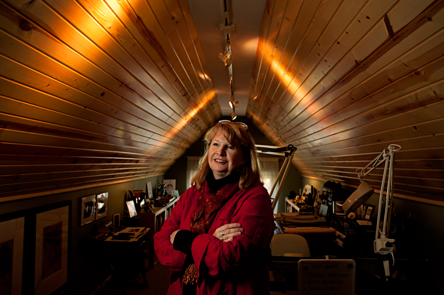 Linda Rzoska, owner of Ninth Wave Studio, stands in her work space on the top floor of the studio. 