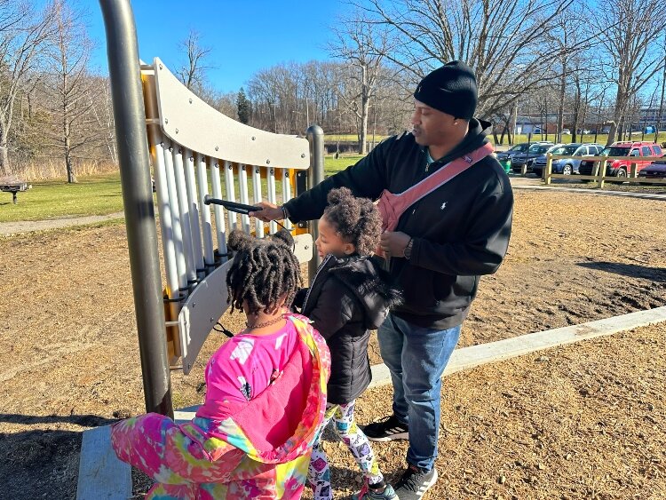 Norman Peak explore the new inclusive playground at Milham Park. (Shandra Martinez)