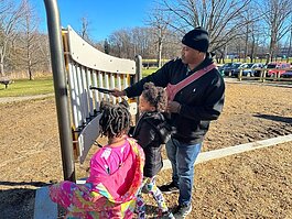 Norman Peak explore the new inclusive playground at Milham Park. (Shandra Martinez)