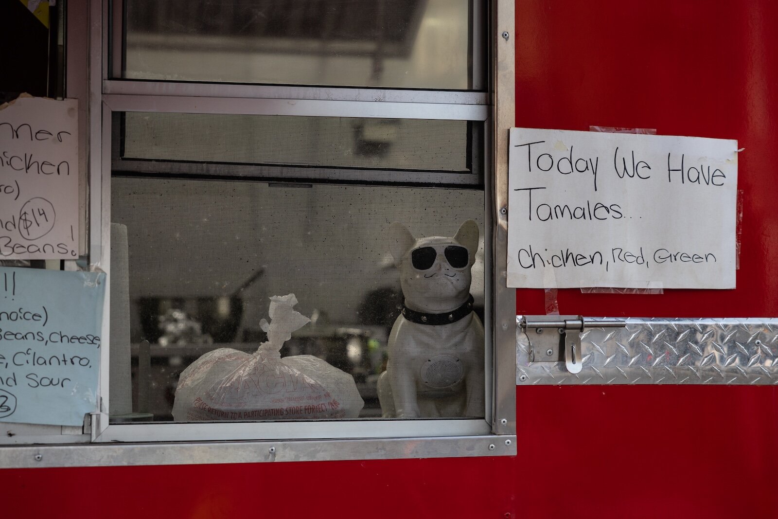 An order awaits pick-up on the window sill at Tacos El Jefe. 
