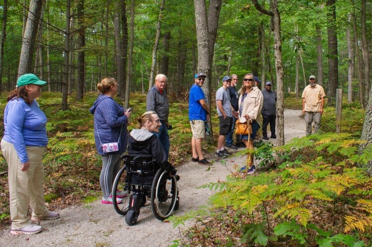 A group explores the accessible Sandy Hansen Birding Trail in Fruitport.