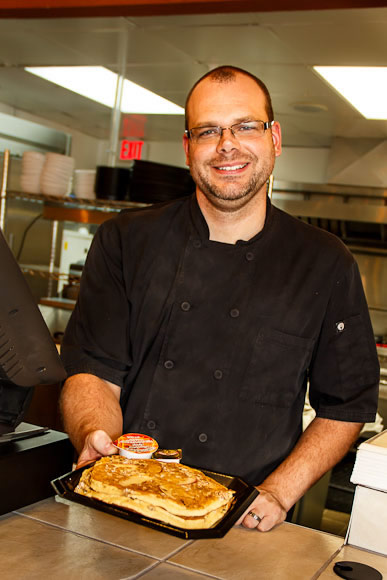 Brad Loomis serving up pancakes