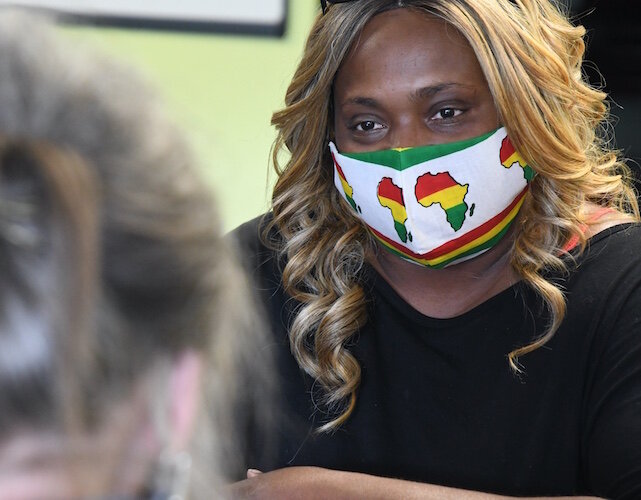 Antwoine Davis, once a Health Care Advocate with Summit Pointe, often helped people in Calhoun County deal with housing issues. Here she meets with a potential client, at the SHARE Center as seen in July 2020. Davis has since passed away. 