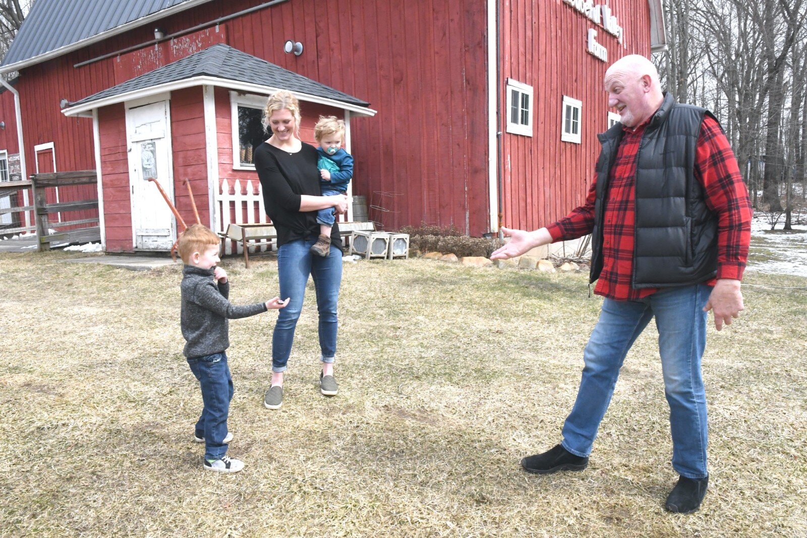 A. J. Jones, right, and Chase Warner, son of the new property owners, tease each other. Terin Warner, seen holding son Noah, and her husband Cody are the new owners.