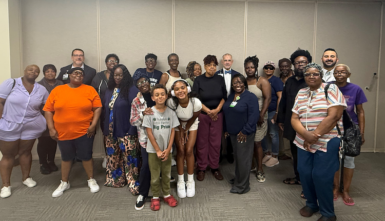 Team members from Bronson Battle Creek Hospital and the Southwestern Michigan Urban League, alongside community members, gather for a group photo celebrating the recent partnership and shared commitment to advance community health in the BC area..