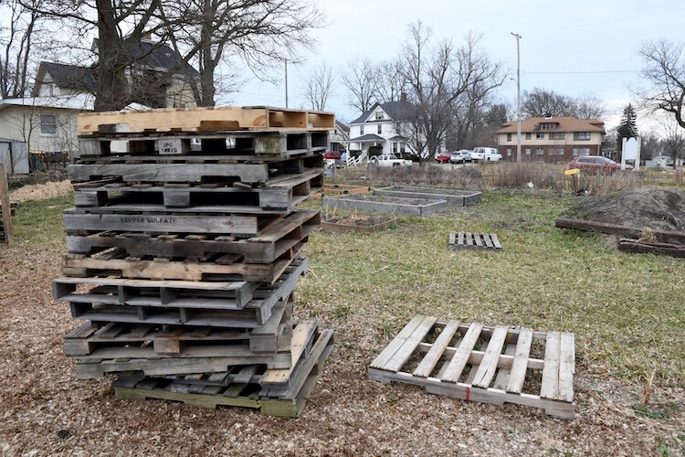 Stacked pallets and raised garden beds at the Fremont Garden