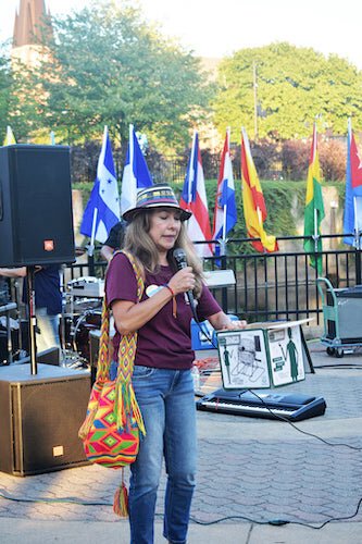 Lucy Mosquera, a founding member of the Battle Creek Latin American Heritage Initiative and co-founder of Nueva Opinion, a Spanish language newspaper based in Battle creek, addresses the audience during a Sept. 25 gathering at Friendship Park.