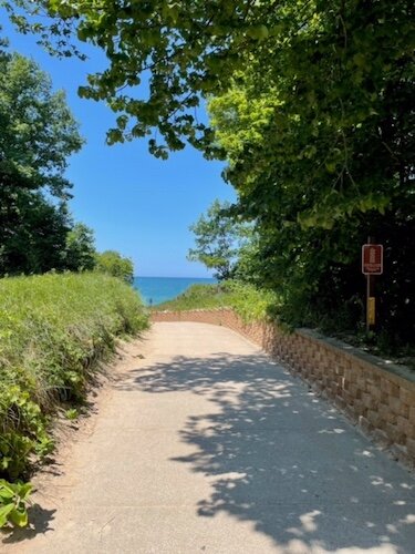 The end of the paved walkway to the beach was eroded by record-high lake levels, and is slated for repair.