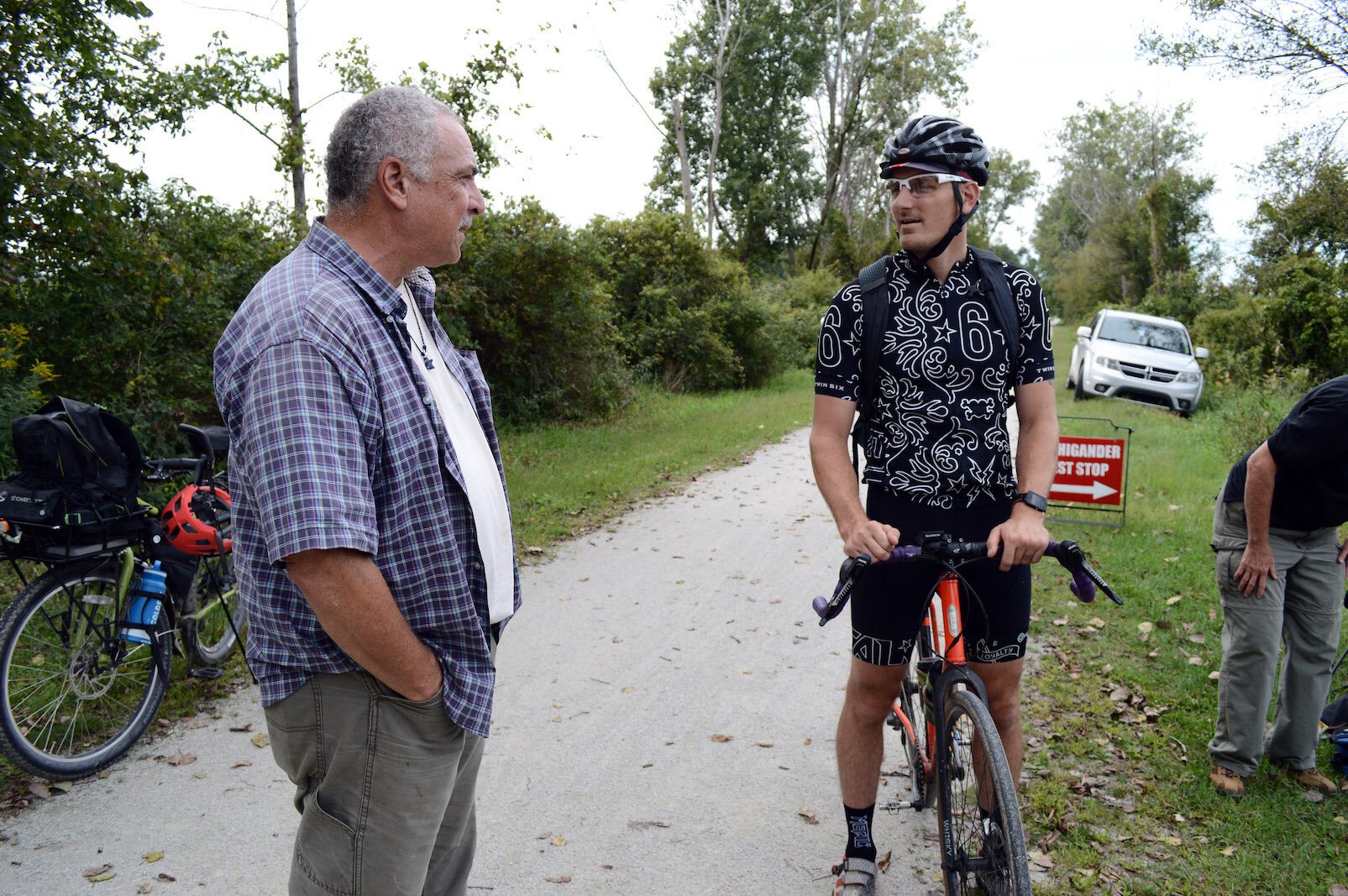 Jeff Green (left), of the Friends of the Kal-Haven Trail, chats with DNR manager Matt Metzger at a bike event on the Kal-Haven last September.