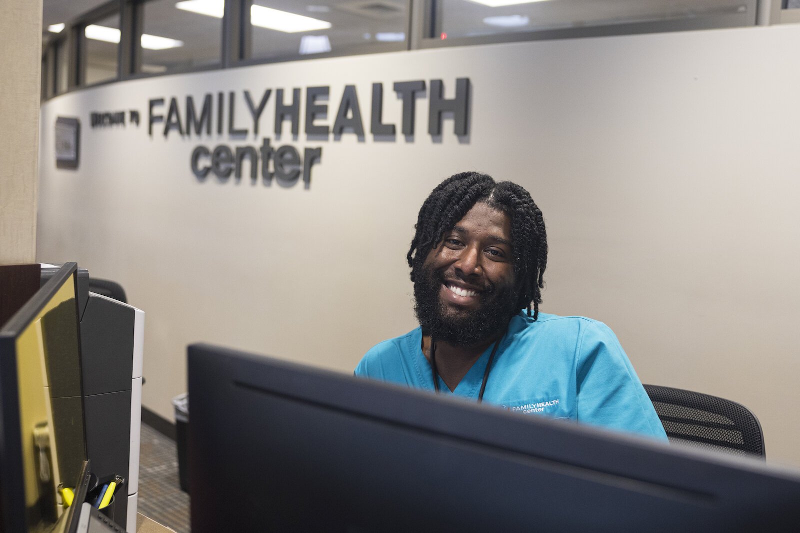 Customer Experience Tech, Kendric Jackson, checks in a patient at the Family Health Center in Kalamazoo, Michigan on Monday, Sept. 25, 2023. (Joel Bissell | MLive.com)