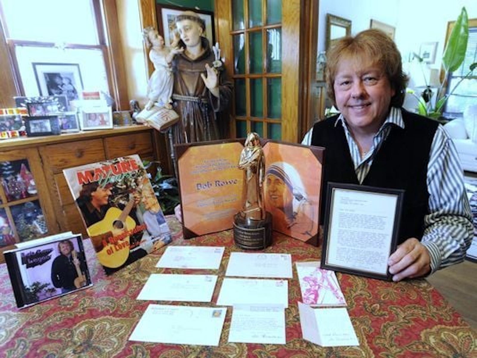 Bob with Mother Teresa letters and awards.