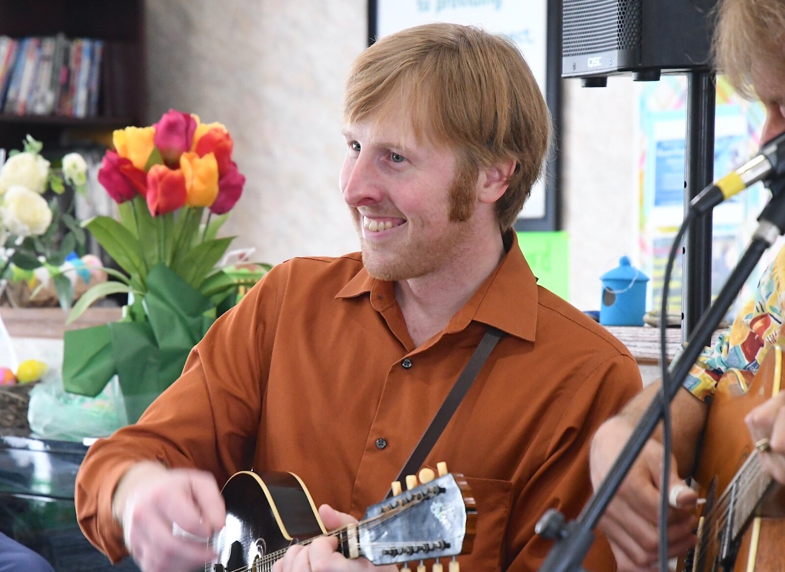 Luke Lenhart plays the mandolin for residents of Park Place Assisted Living in Kalamazoo.
