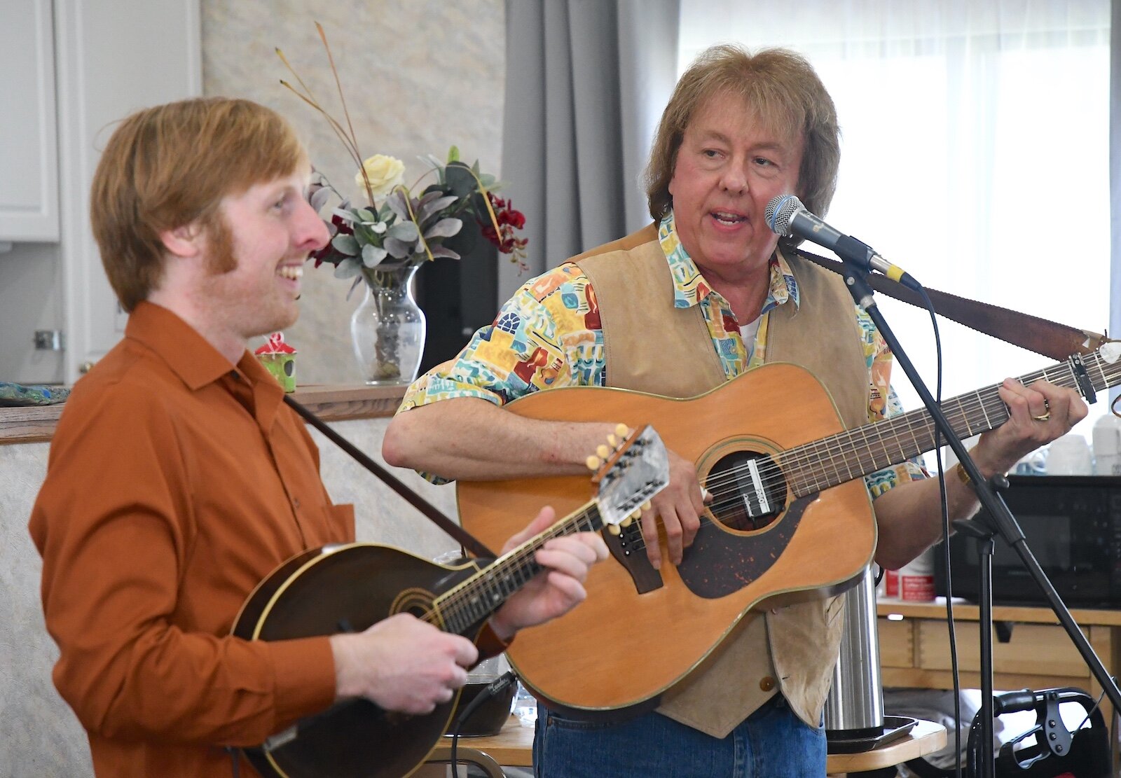 Luke Lenhart, left, and Bob Rowe perform for residents of Park Place Assisted Living in Kalamazoo.