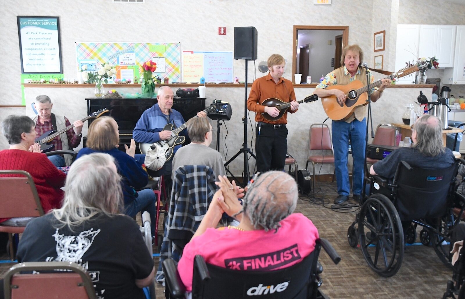 Bob Rowe, far right, and the Green Valley Boys perform for residents of Park Place Assisted Living in Kalamazoo..