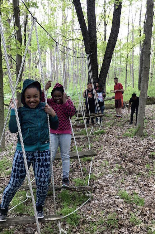 Boys and Girls Club participants practice their rope skills.