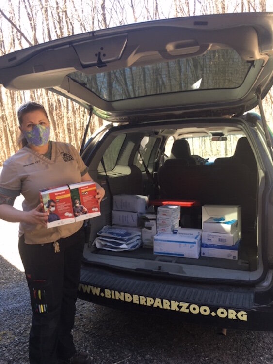 A zoo staffer unloads Personal Protection Equipment — face shields, N95 masks, disposable gowns, surgical masks and caps, foot covers and gloves were delivered to the Bronson Battle Creek collection site.