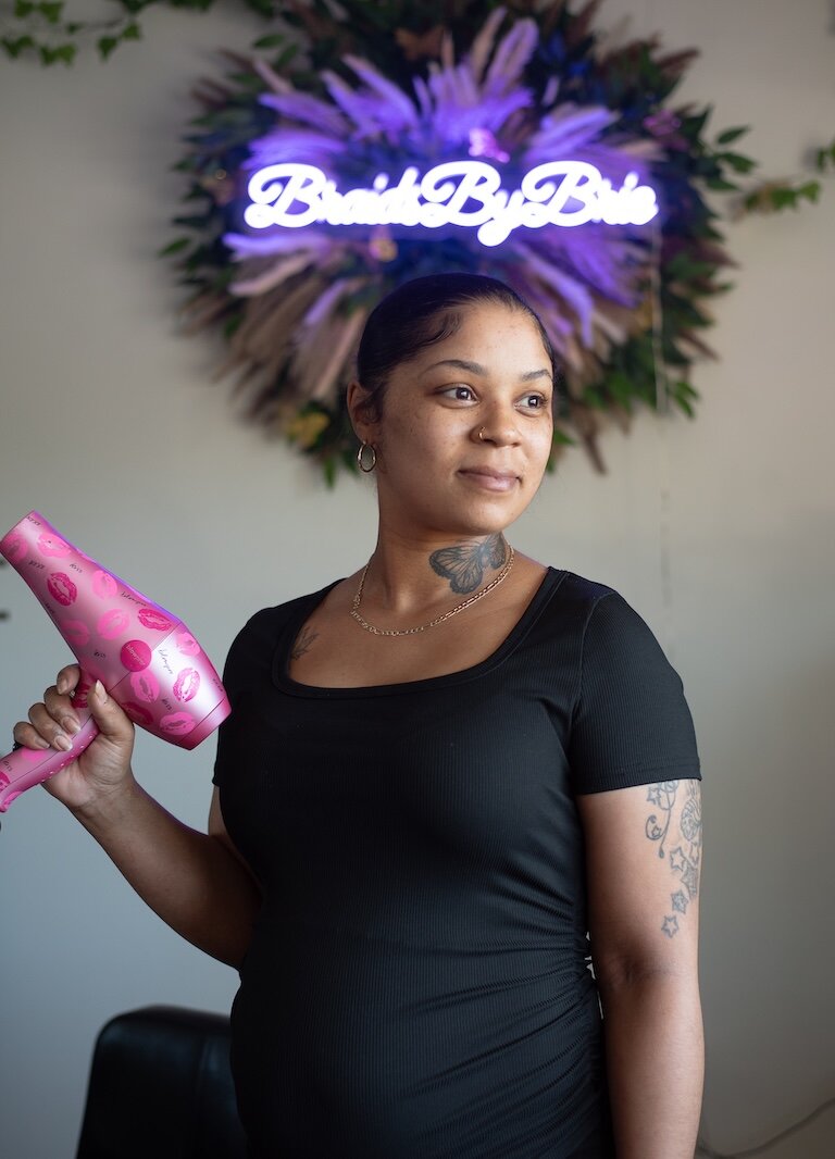 Brianna Cox of Braids by Brie, one of six partner hair professional salons and barbershops that work with Dream of Kalamazoo Foundation, to provide hair services to multi-racial and Black foster children.