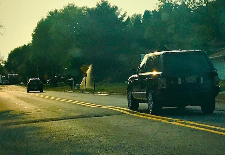 A car travels over a speed hump on Kalamazoo's West Side, similar to what is being proposed as a solution to speeding in other neighborhoods.