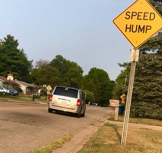 A sign marking a a speed hump on Kalamazoo's West Side, similar to what is being proposed as a solution to speeding in other neighborhoods.