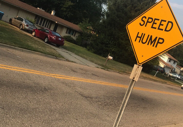 A sign marking a a speed hump on Kalamazoo's West Side, similar to what is being proposed as a solution to speeding in other neighborhoods.