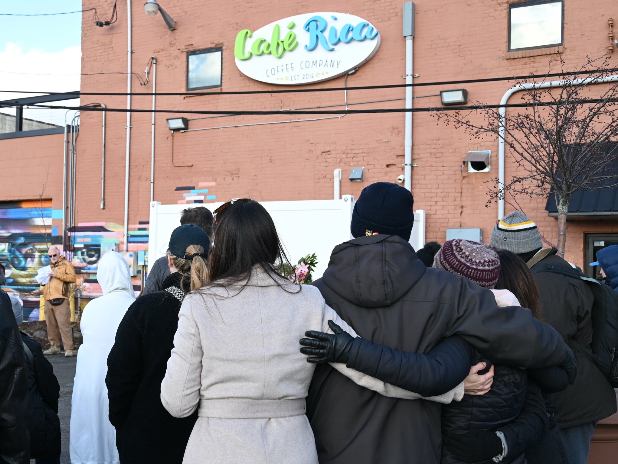 Seventy-five to eighty people attended Sunday afternoon’s vigil behind Cafe Rica.