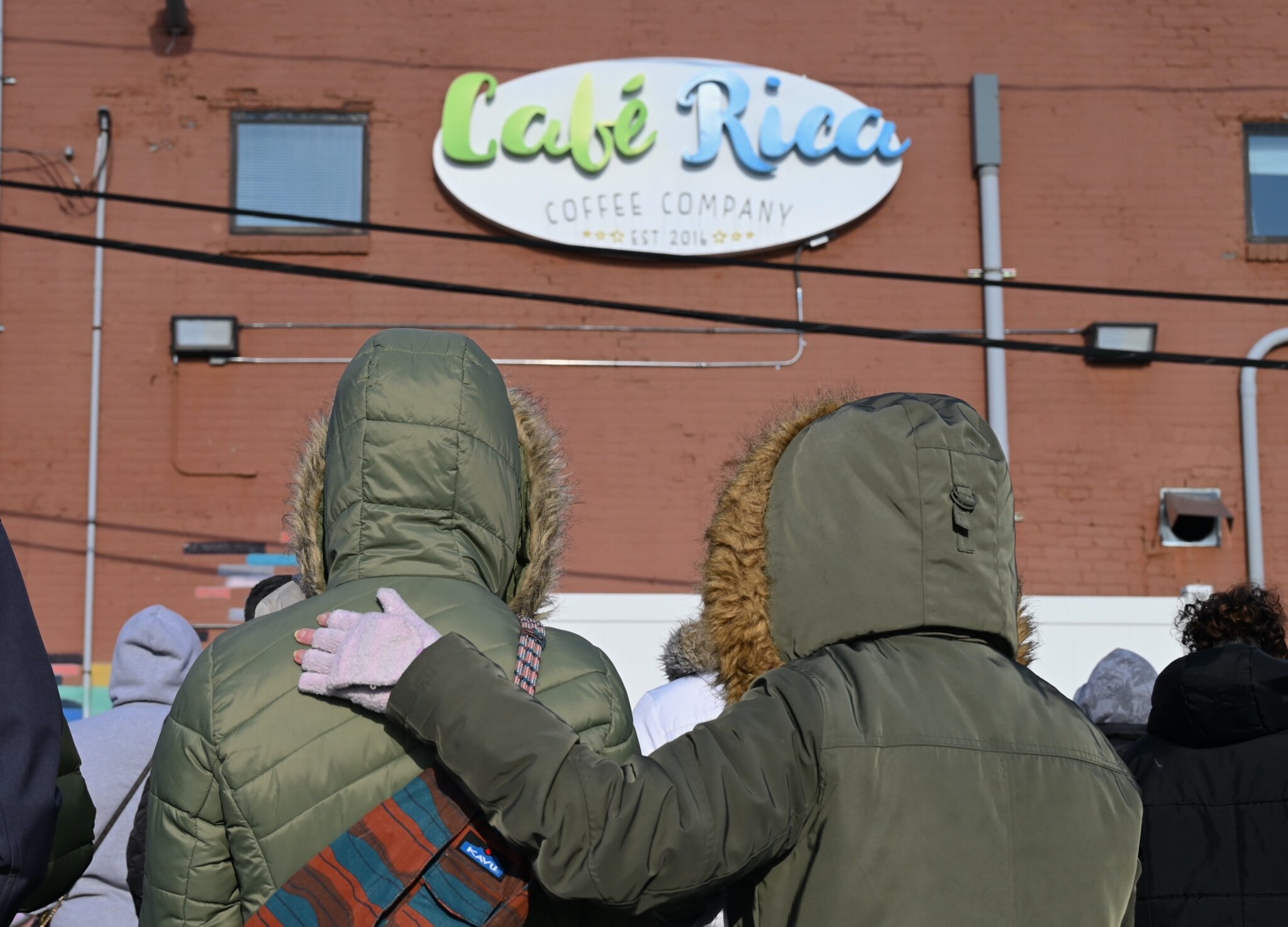Seventy-five to eighty people attended Sunday afternoon’s vigil behind Cafe Rica.