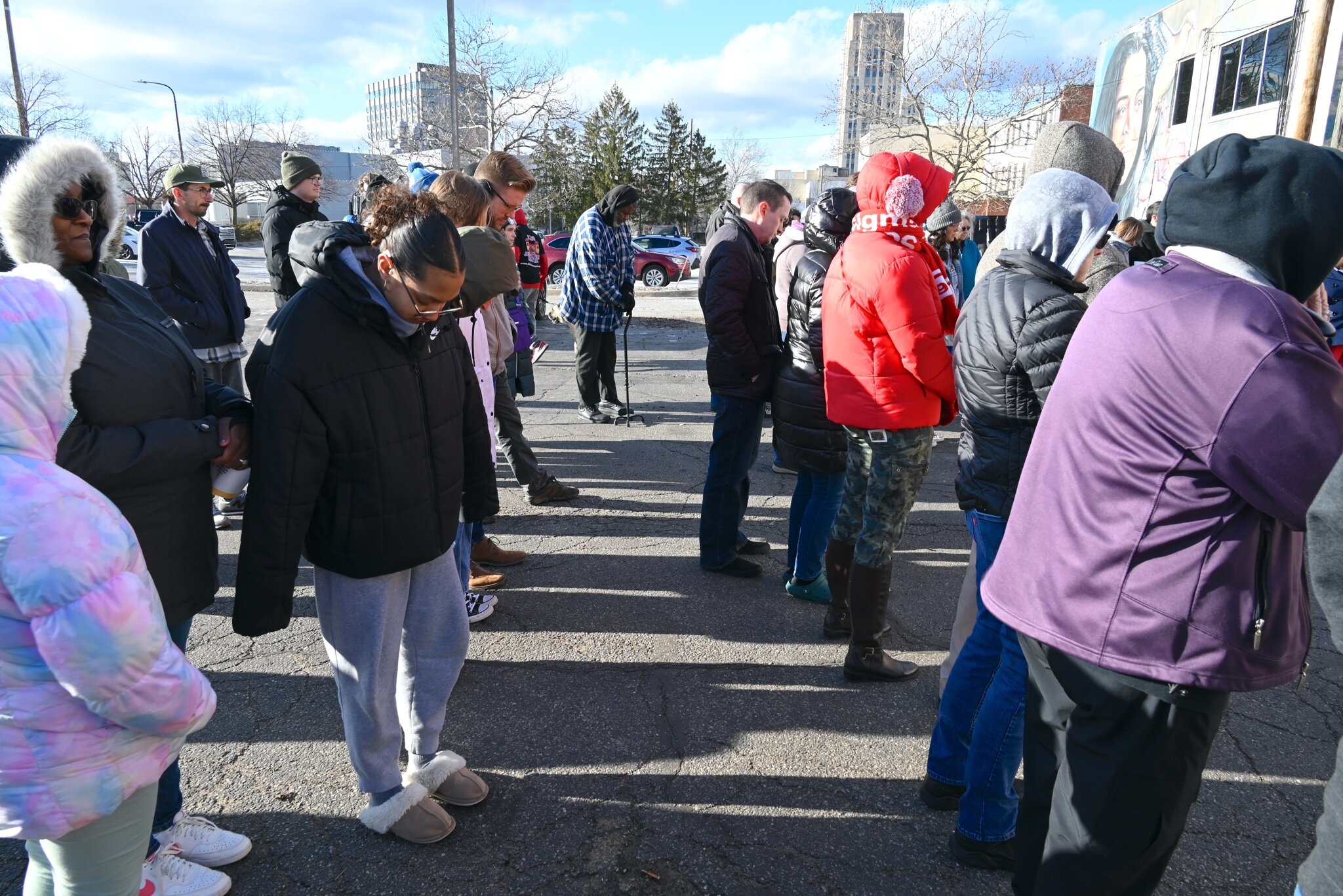 Seventy-five to eighty people attended Sunday afternoon’s vigil behind Cafe Rica.