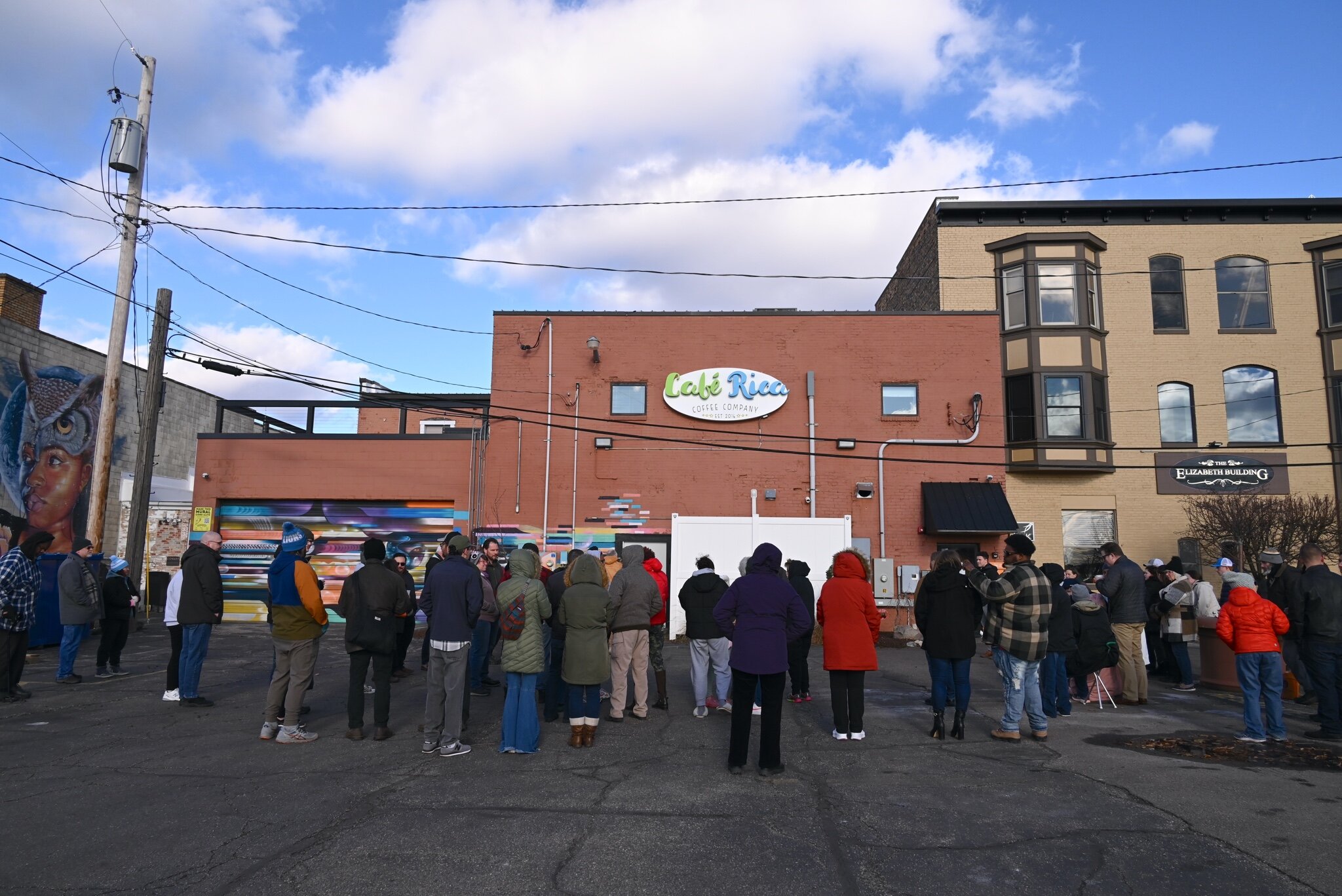 Seventy-five to eighty people attended Sunday afternoon’s vigil behind Cafe Rica