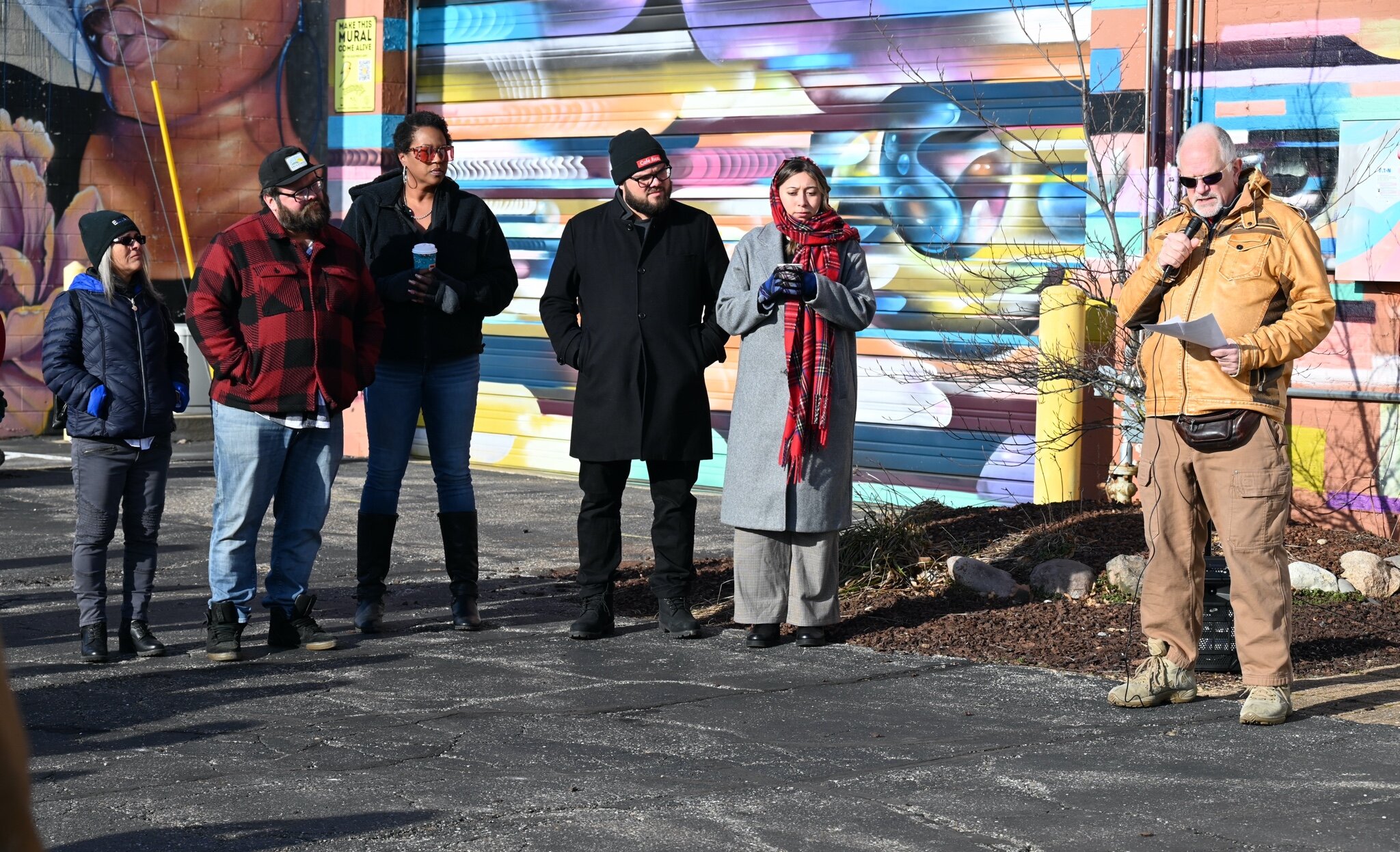 George Bredehoft speaks during Sunday afternoon’s vigil behind Cafe Rica.