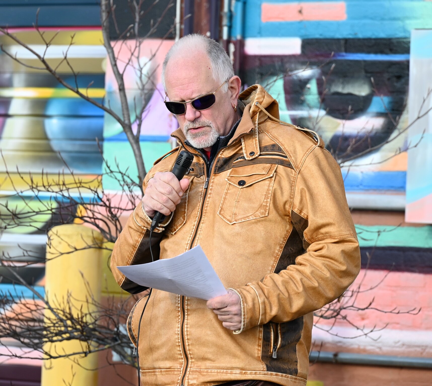George Bredehoft speaks during Sunday afternoon’s vigil behind Cafe Rica.