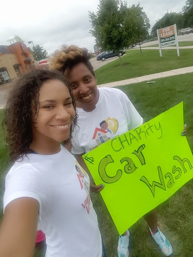 Raising funds by washing cars. 