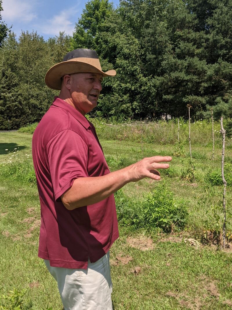 Carlos Fontana explains how he plots out areas to plant the more than 30 types of vegetables he grows in his farm garden.