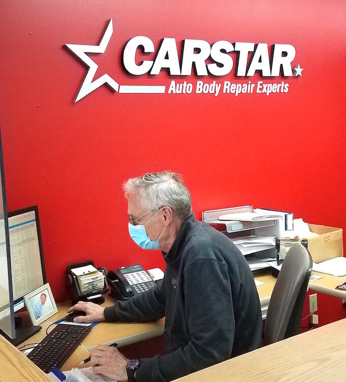 Dale DeGroot, owner of Carstar Kalamazoo, works at his business. He said he was pleased with the ease of applying for a loan locally from the Kalamazoo Small Business Loan fund.