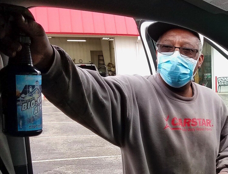 Service technician Robert Head disinfects a vehicle at CARSTAR Kalamazoo.